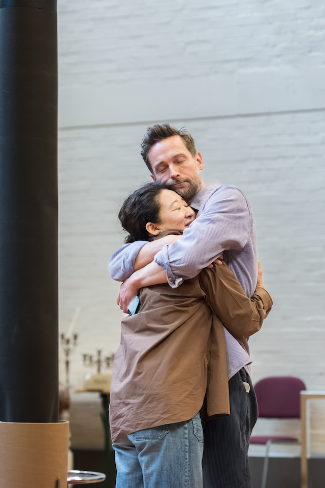 Rehearsal photo with Tom and Sandra Oh hugging